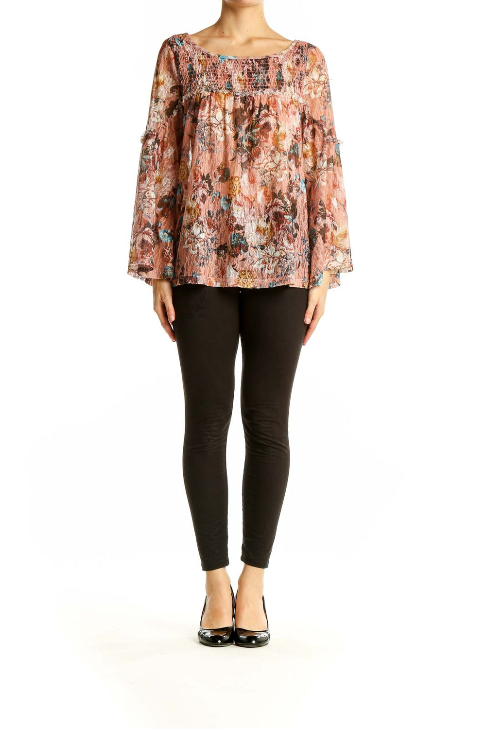 Front view of Akemi + Kin pink floral bell sleeve blouse with smocked neckline