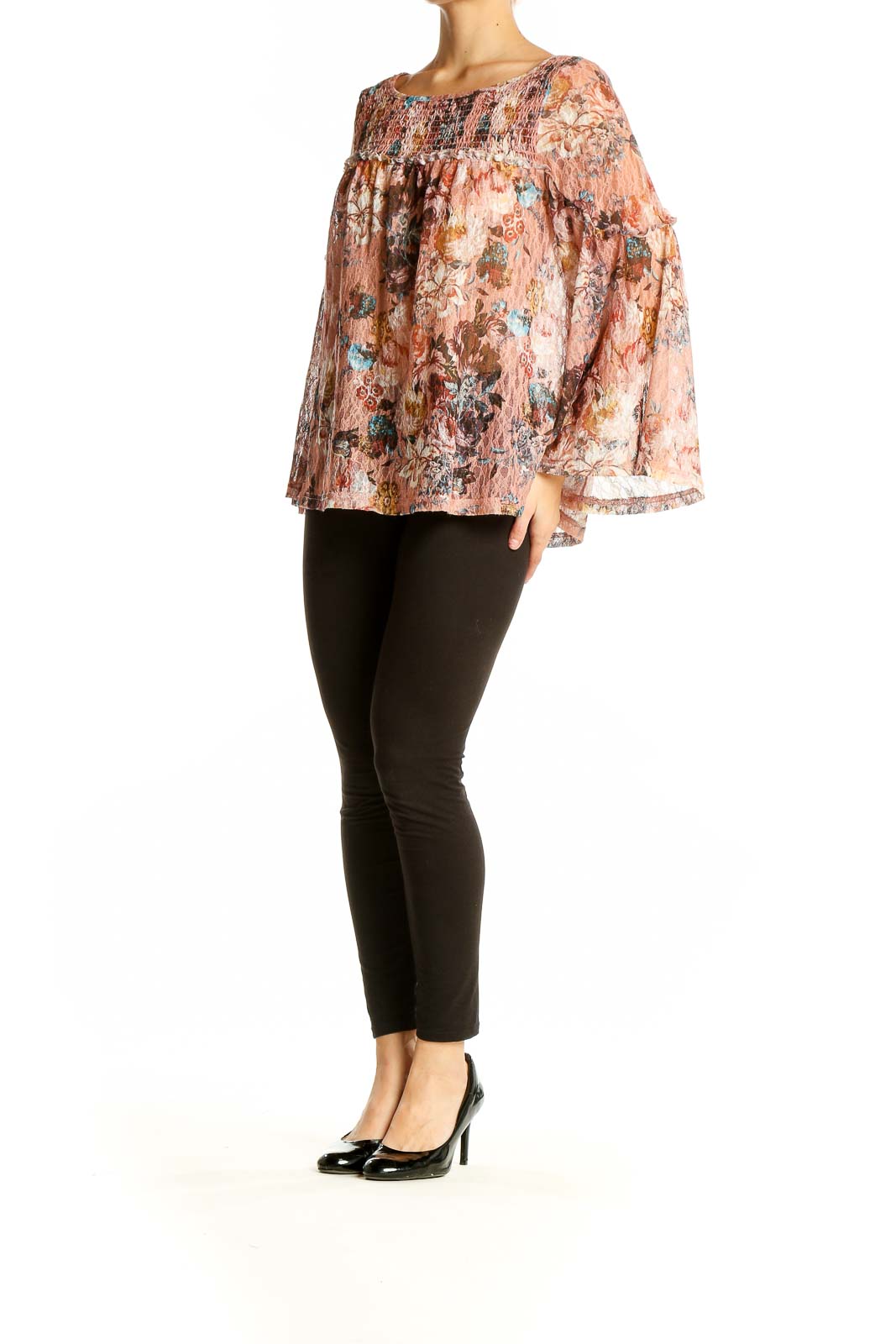 Front view of Akemi + Kin pink floral bell sleeve blouse with smocked neckline