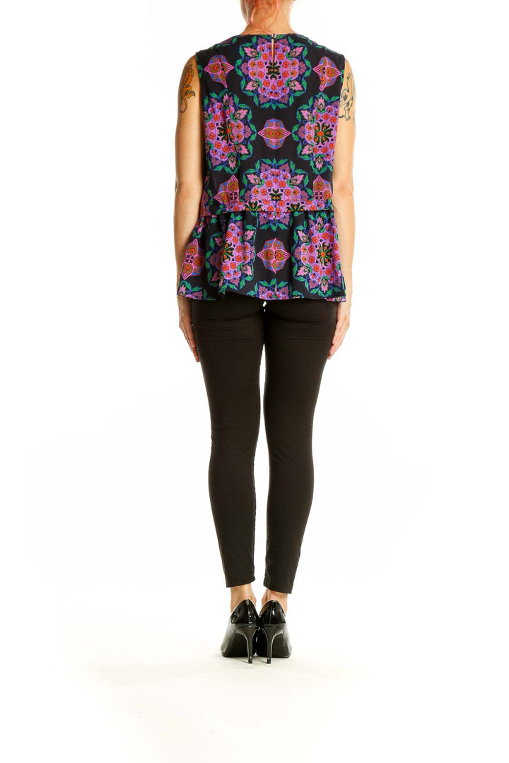 Side view of J.Crew black sleeveless blouse with colorful floral print