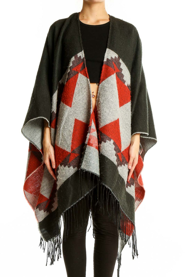 Front view of Oasis olive and red geometric knit poncho with fringed hem