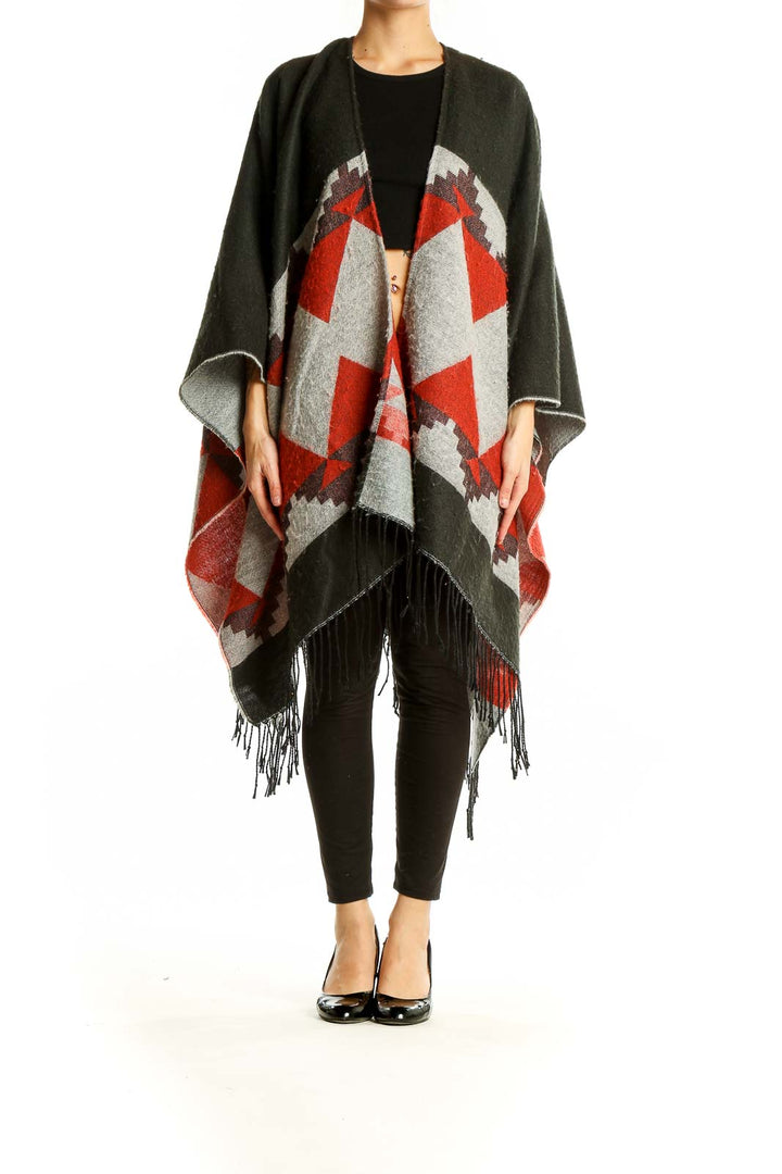 Front view of Oasis olive and red geometric knit poncho with fringed hem