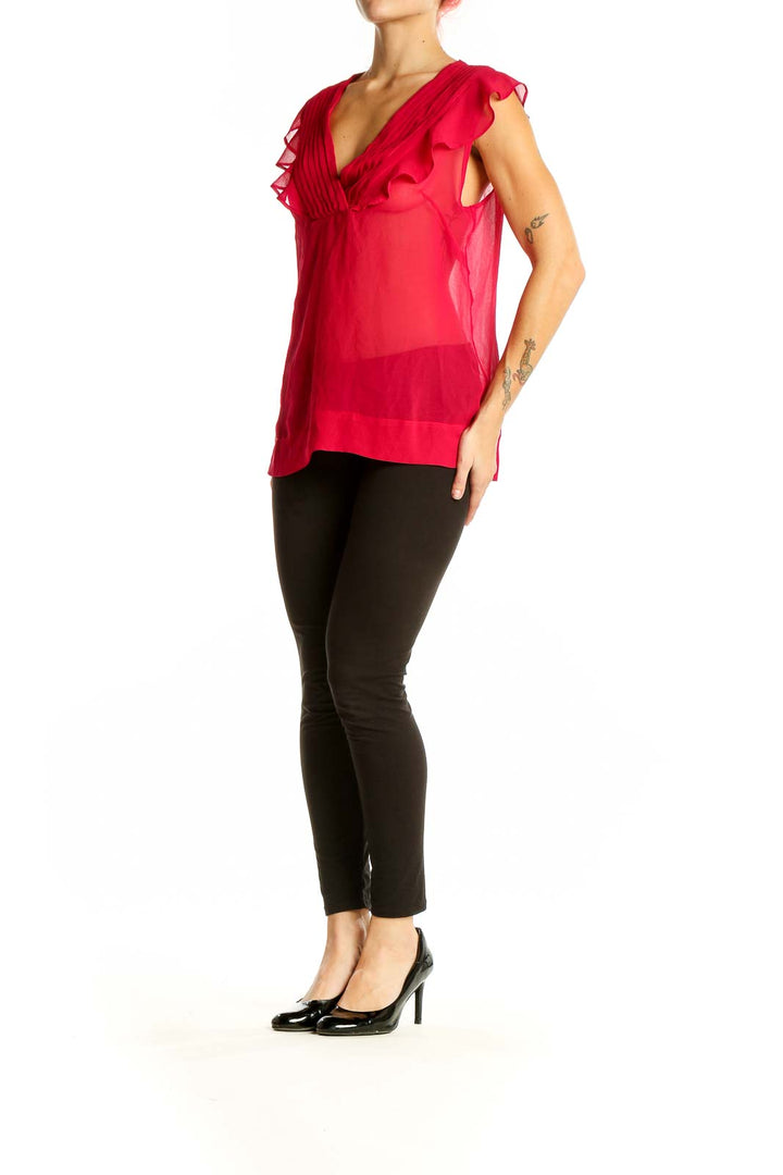 Front view of red sheer ruffled V-neck blouse from Banana Republic