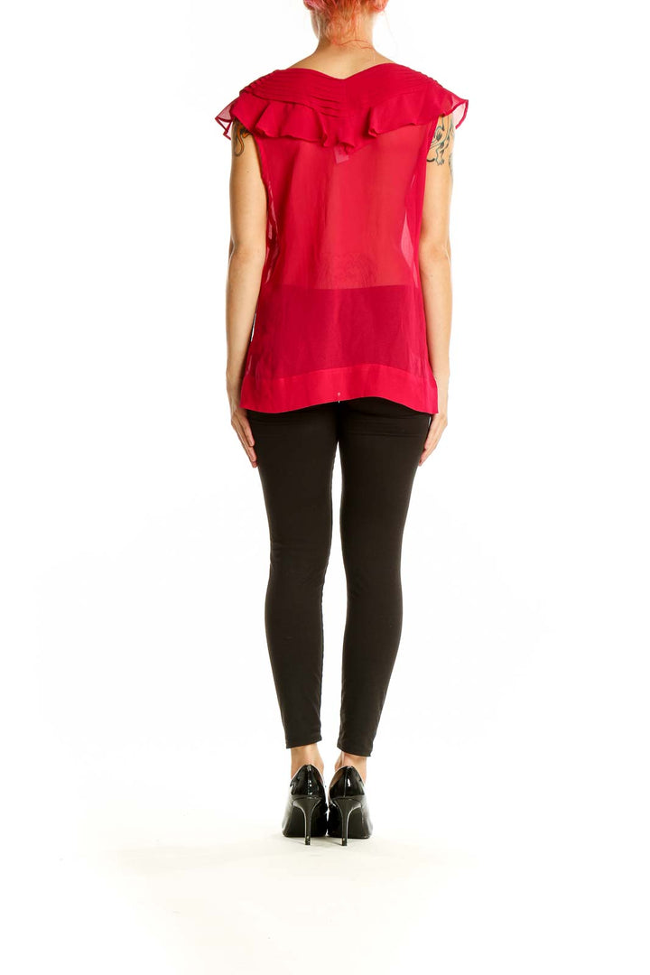 Side view of red sheer ruffled V-neck blouse from Banana Republic on model