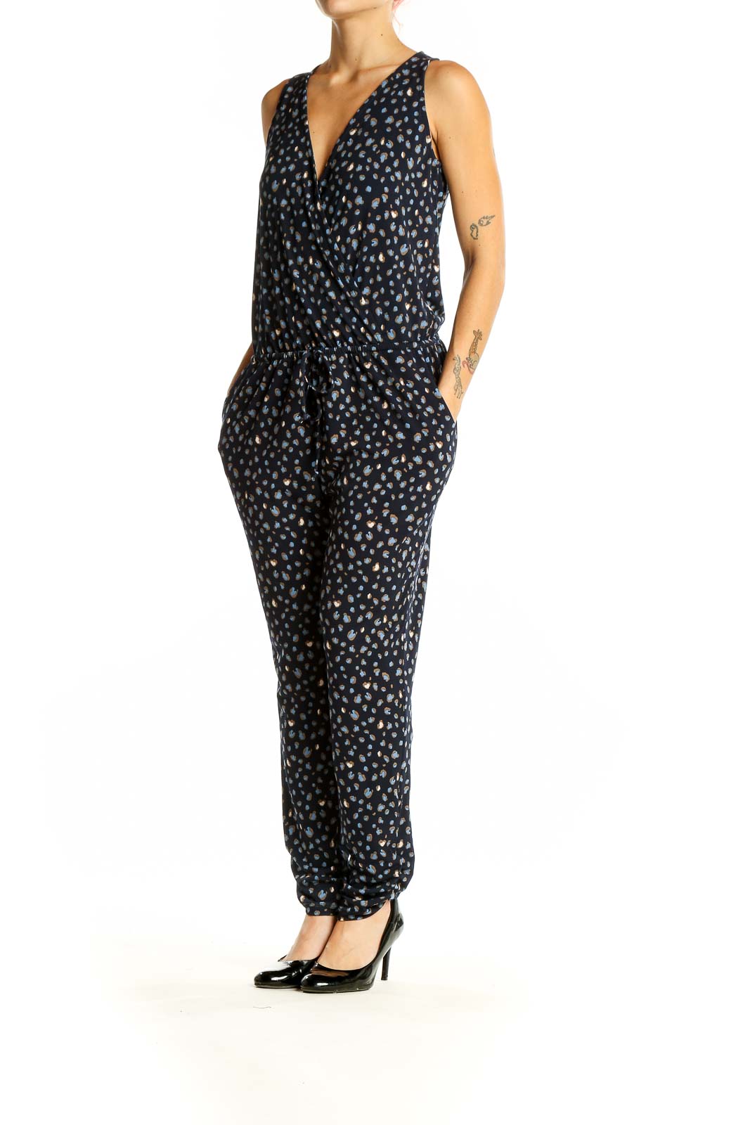 Front view of Veronica M black polka dot sleeveless jumpsuit