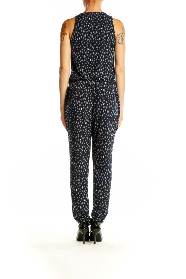 Side view of Veronica M black polka dot sleeveless jumpsuit