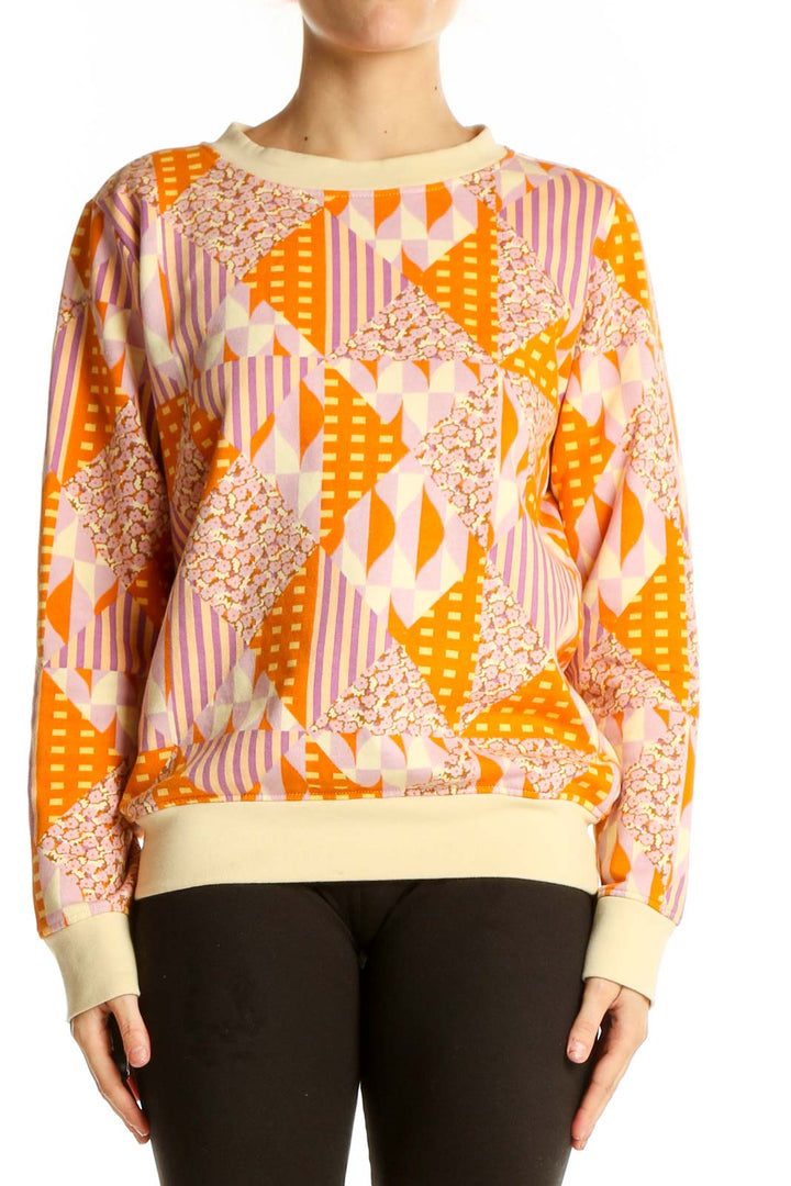 Front view of SagexClare orange geometric print cotton sweatshirt