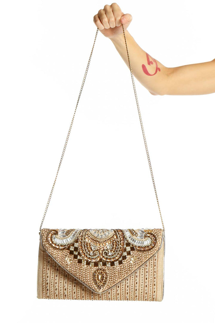 Front view of Lulu's gold beaded envelope clutch with intricate paisley pattern