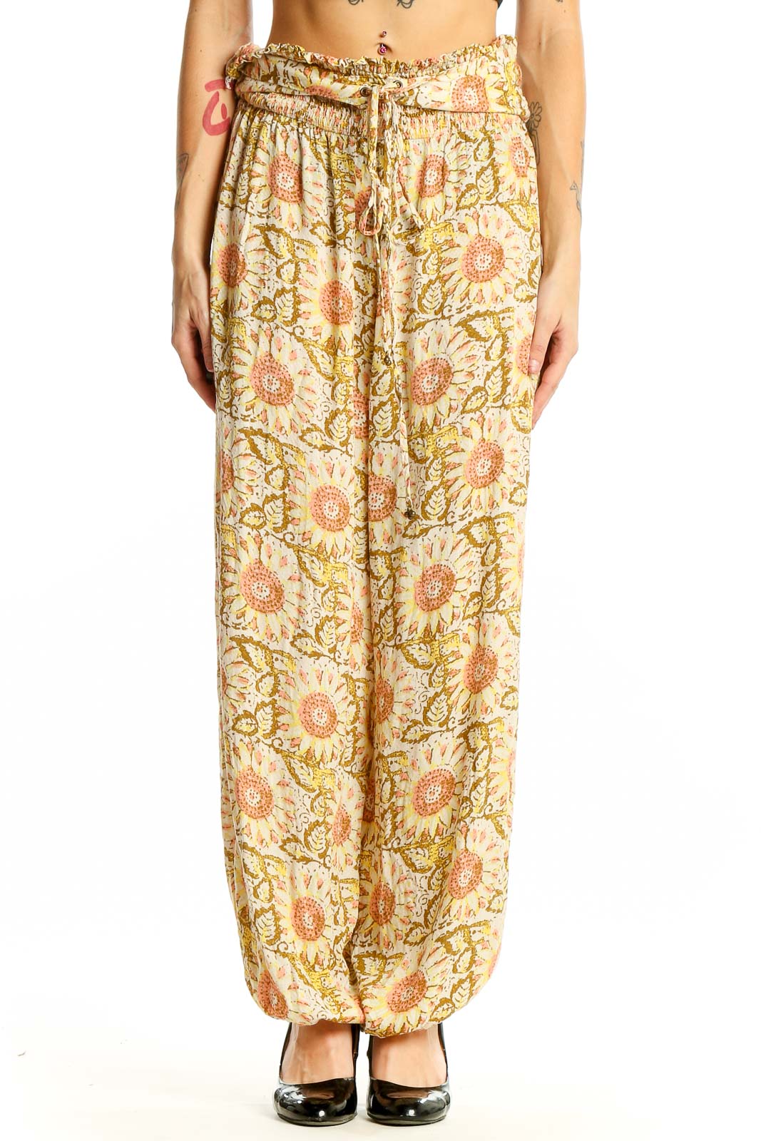 Front view of yellow floral harem pants by Intimately Free People