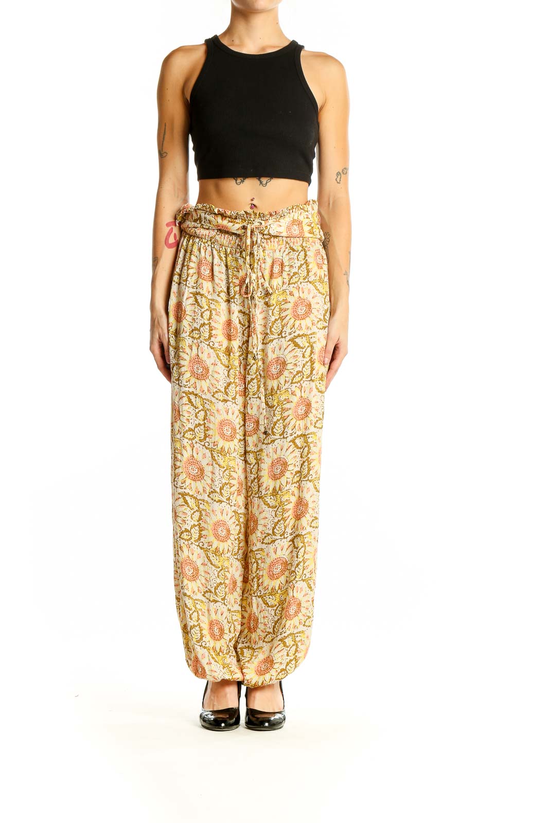 Front view of yellow floral harem pants by Intimately Free People