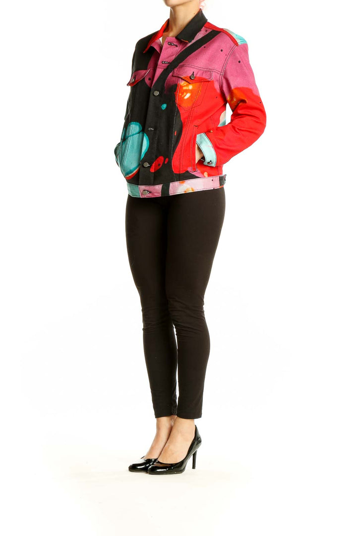 Front view of The Kit's multicolor abstract art denim jacket with vibrant red, pink, black, and turquoise design