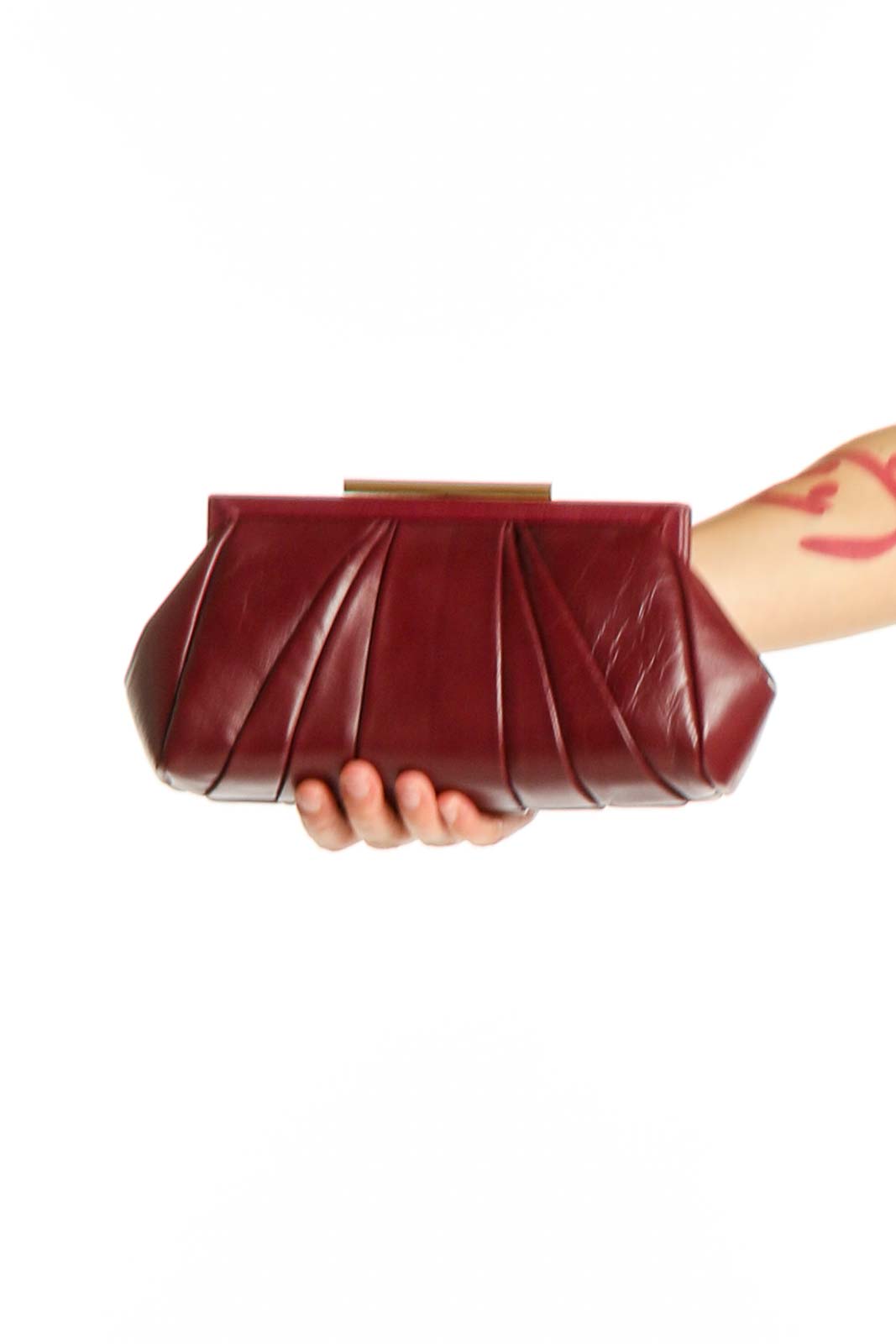 Front view of Badgley Mischka burgundy pleated leather clutch