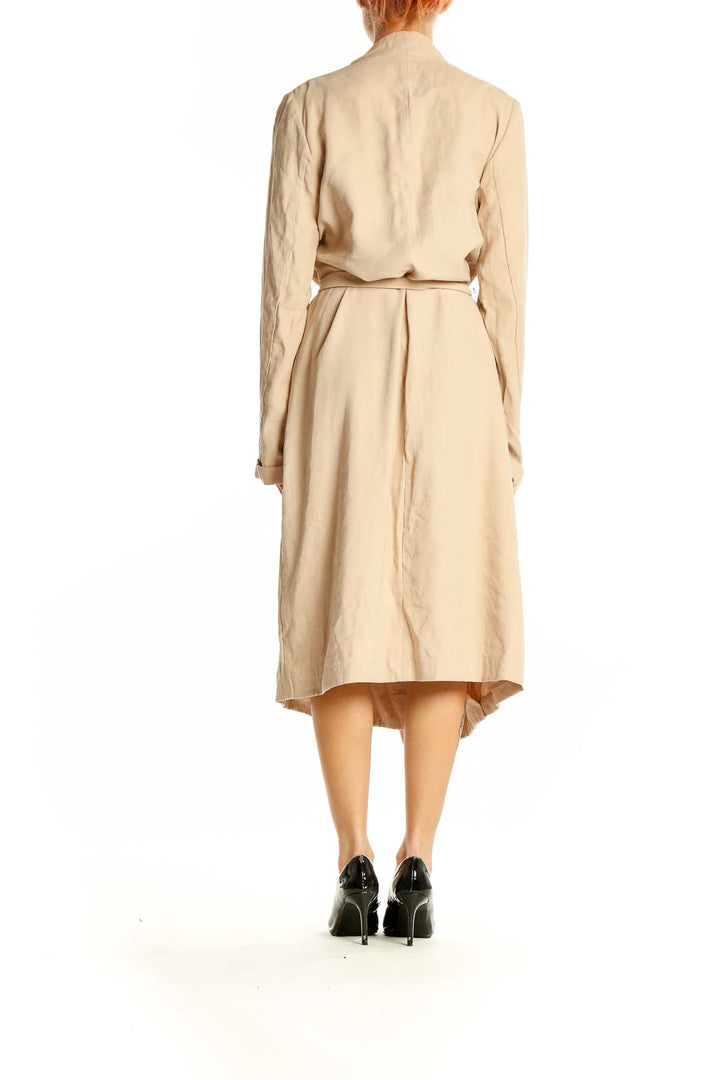 Side view of Express beige trench coat showing length and silhouette