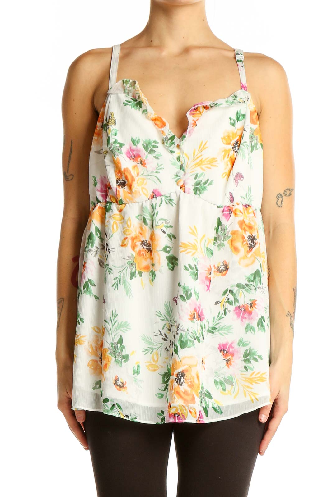 Front view of Torrid white floral babydoll tank top with yellow and pink flowers