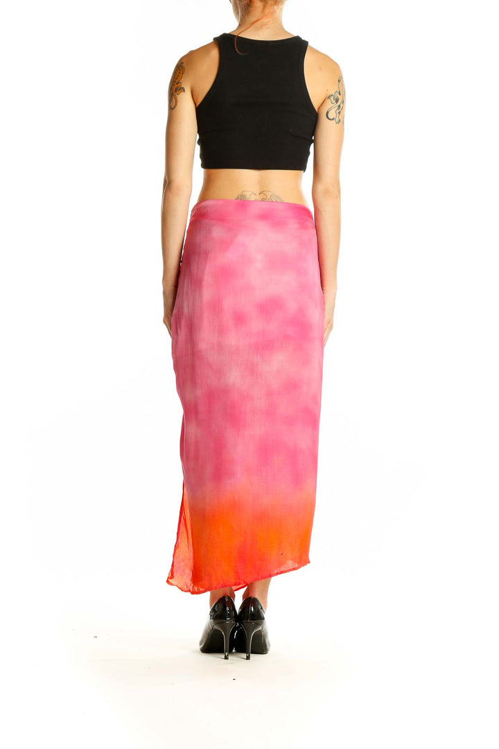 Back view of Area Stars pink ombre tie-dye maxi skirt paired with black crop top