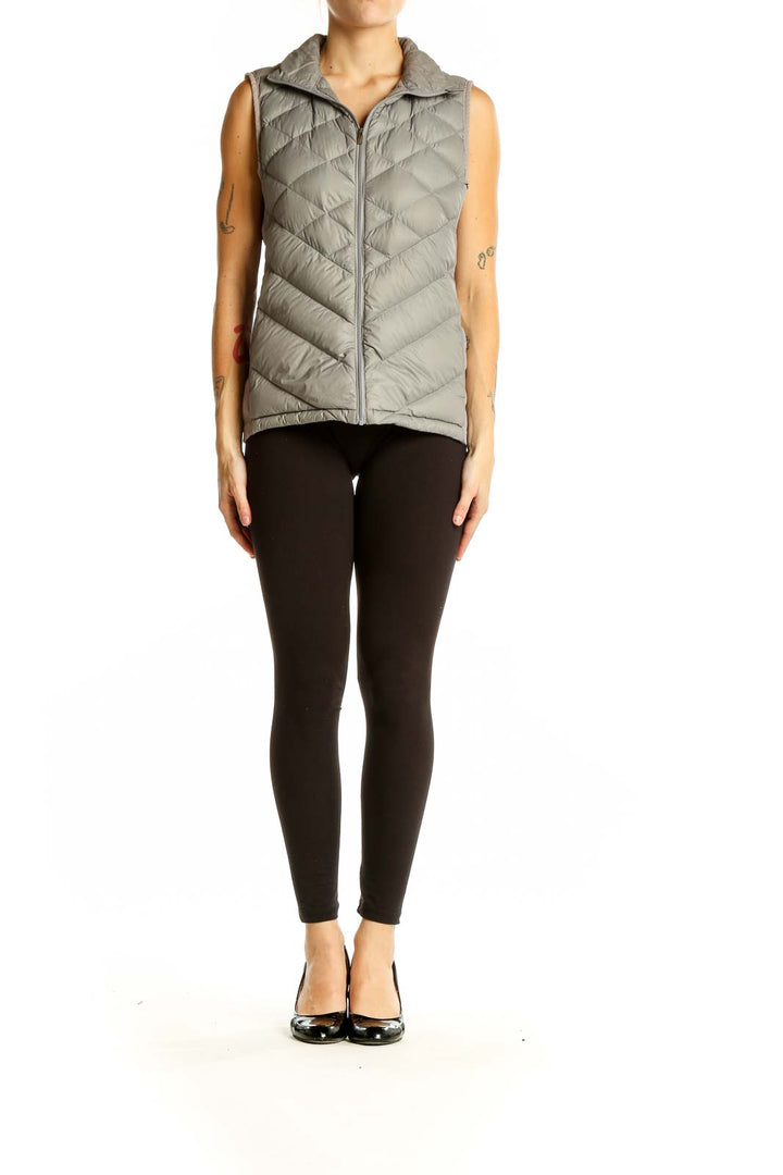 Front view of gray quilted puffer vest by Lucy with chevron pattern