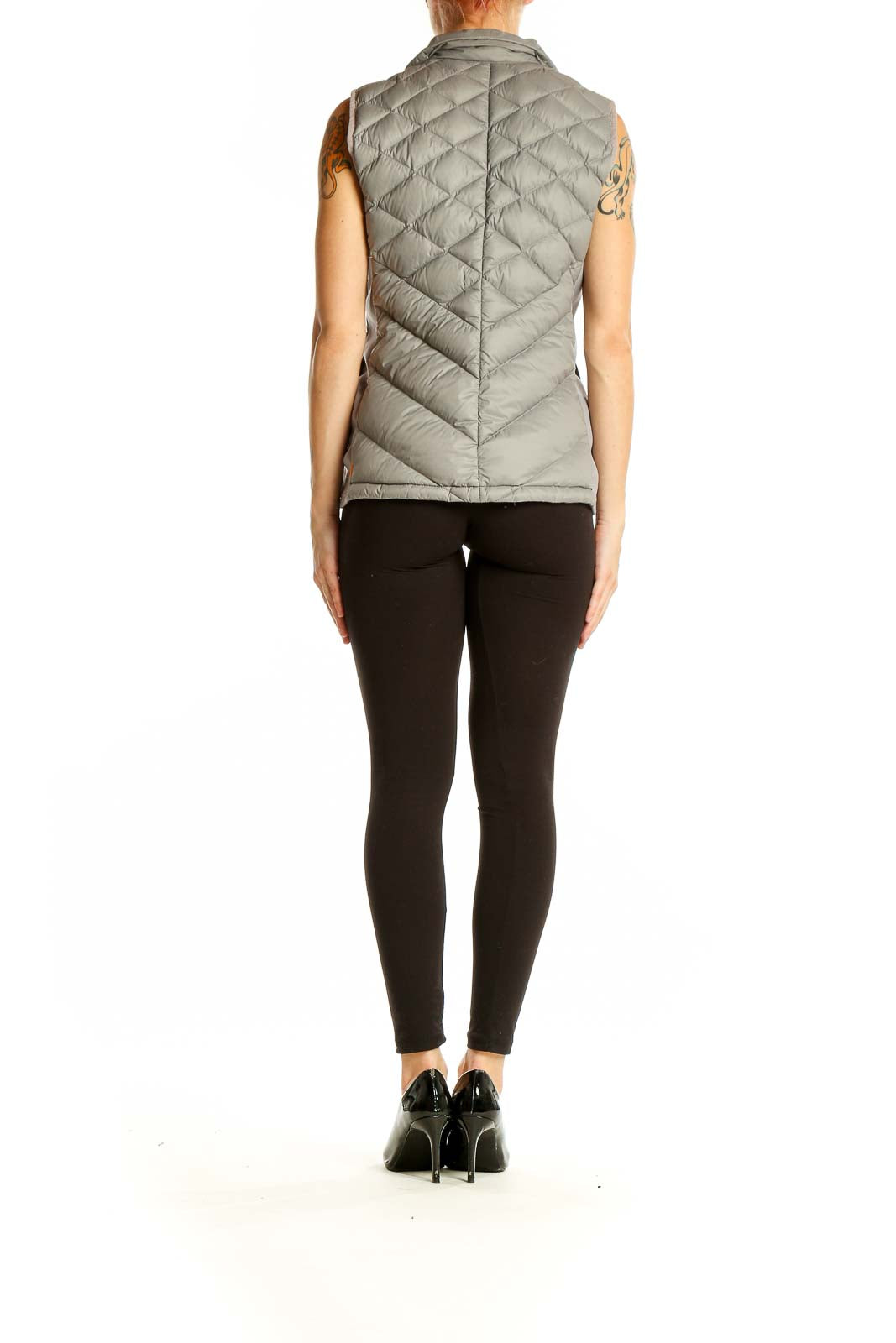 Back view of gray quilted puffer vest by Lucy showing sleek design