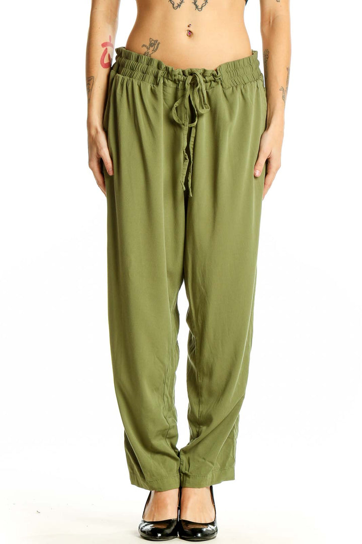 Front view of olive green relaxed-fit drawstring pants from Torrid