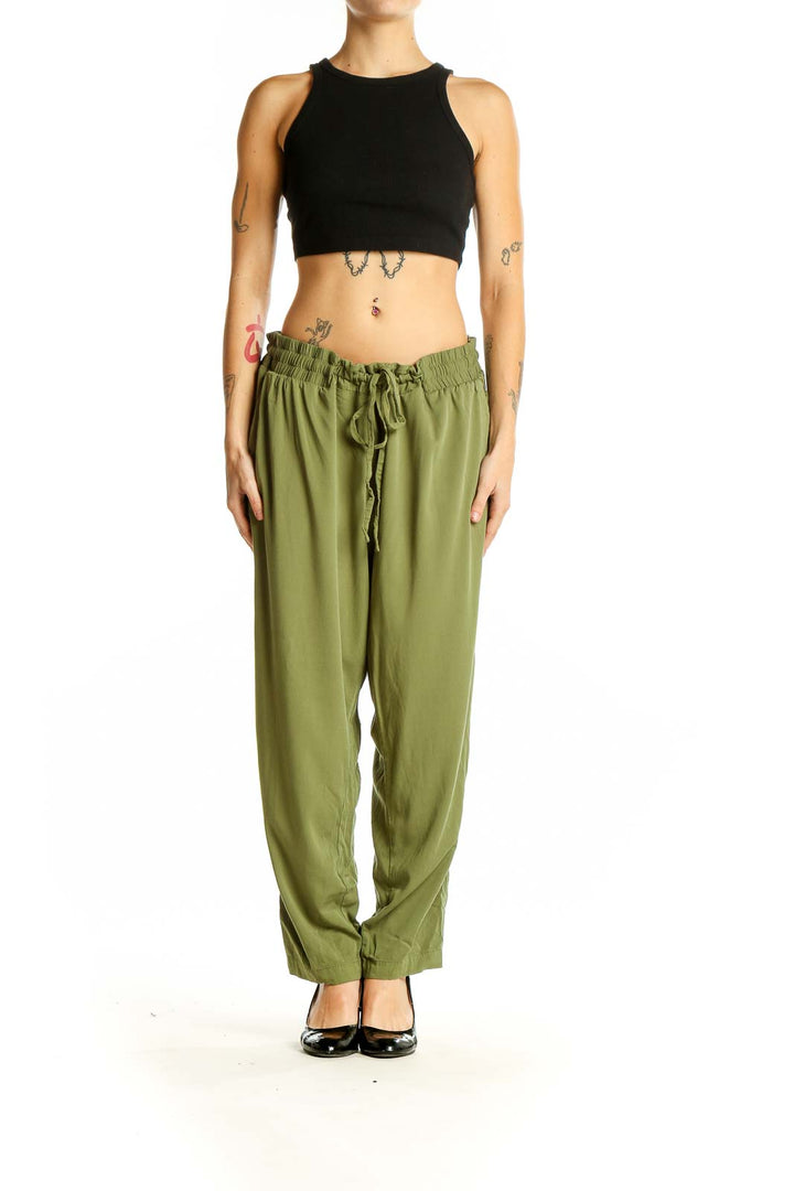 Front view of olive green relaxed-fit drawstring pants from Torrid