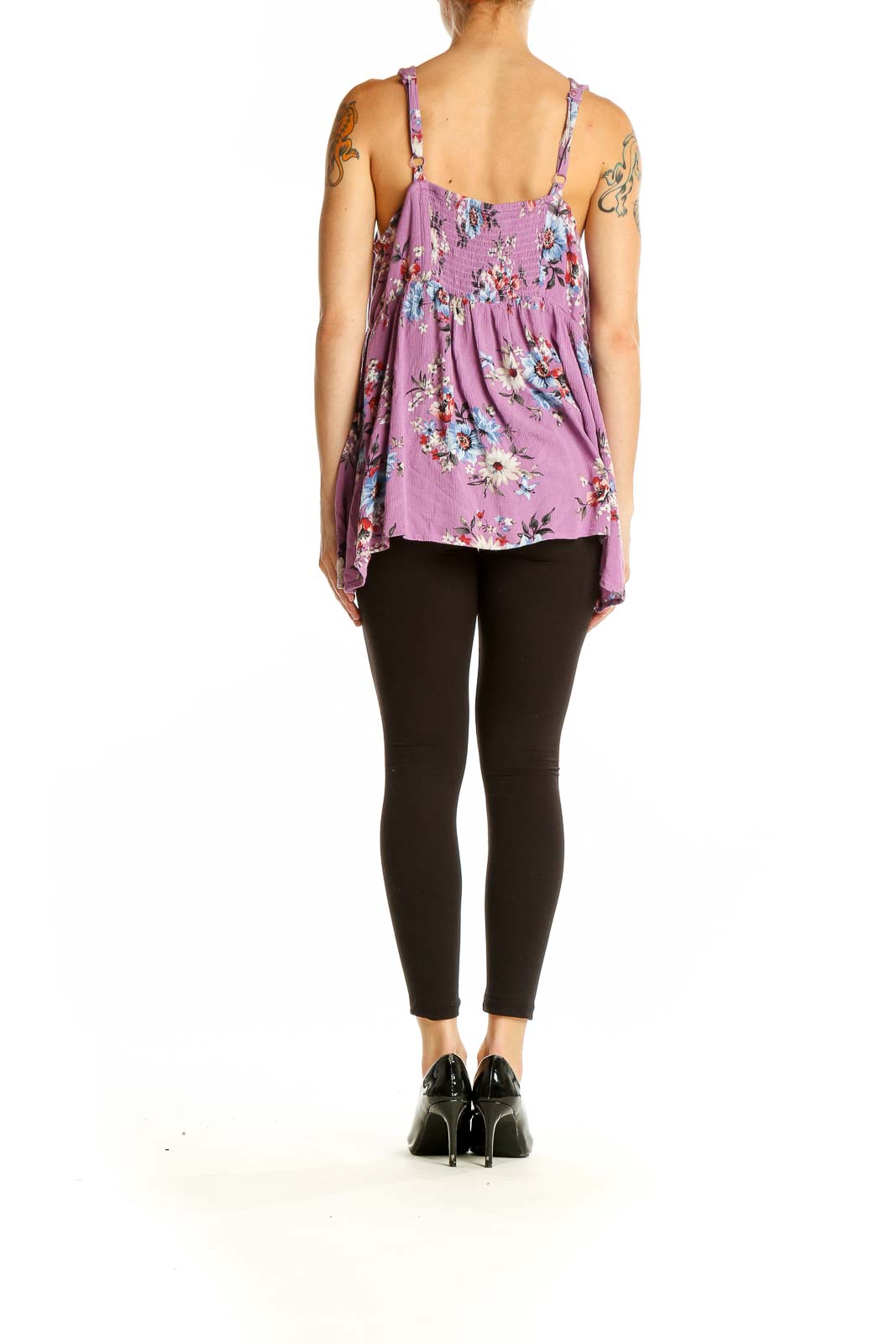 Side view of purple floral button-front tank top from Torrid on model