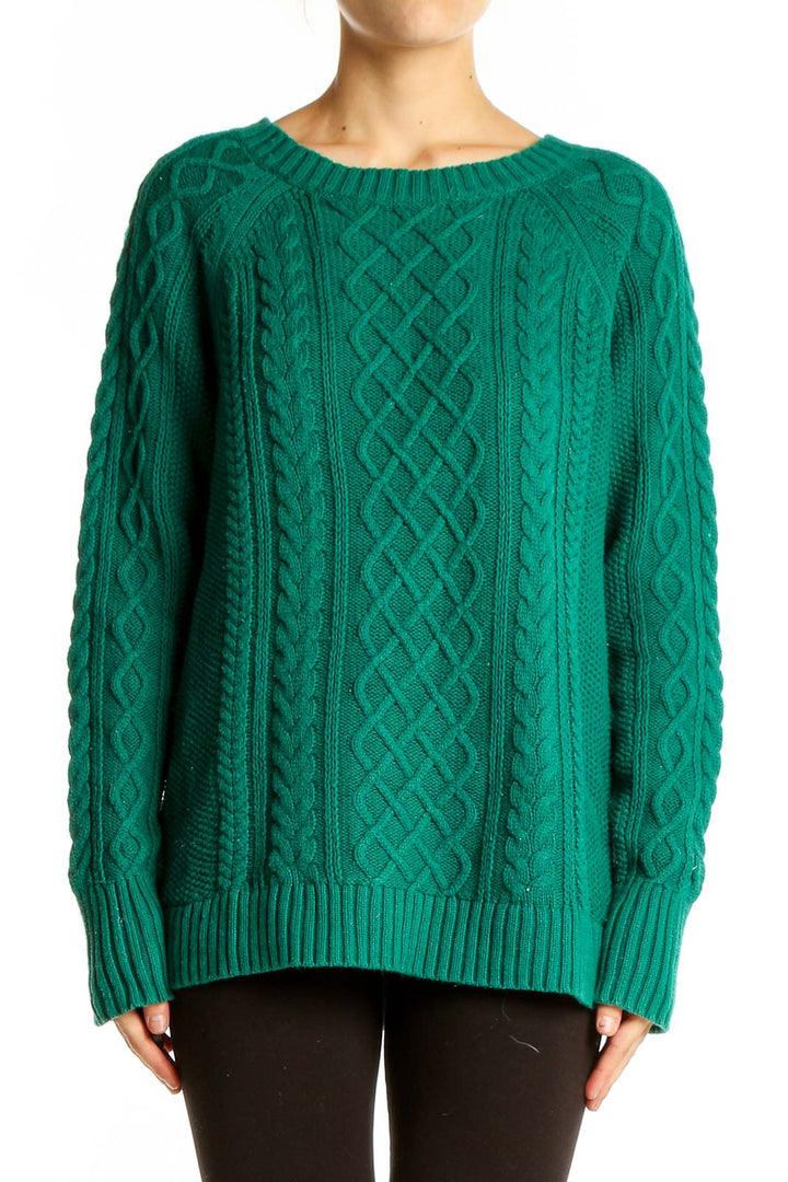 Front view of green Gap cable knit cotton sweater with intricate patterns