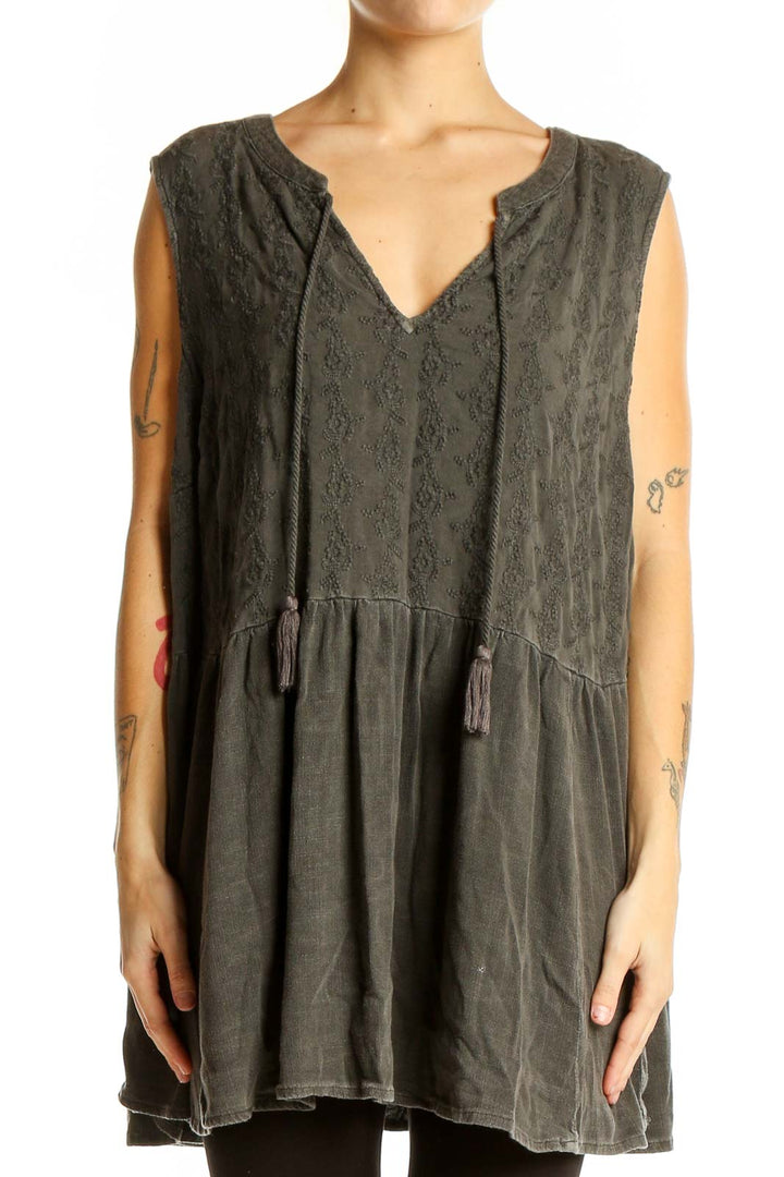 Front view of olive green embroidered sleeveless tunic top from Torrid