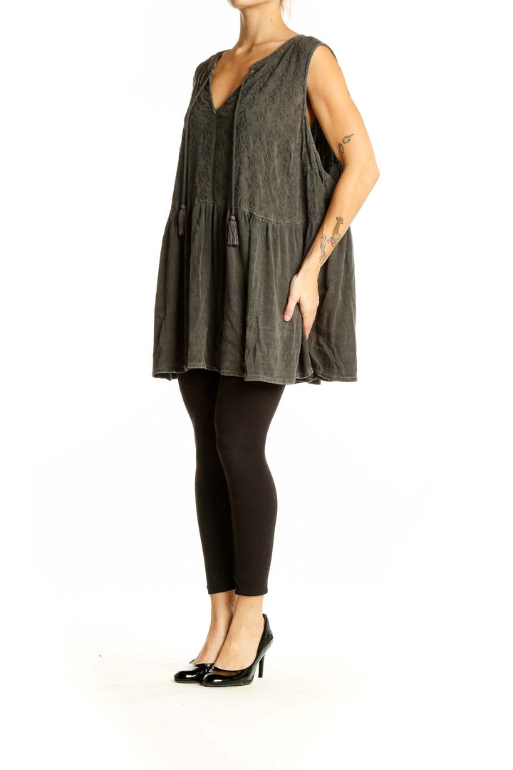 Front view of olive green embroidered sleeveless tunic top from Torrid