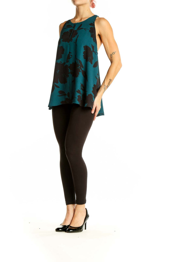 Front view of teal LOFT sleeveless top with black floral print