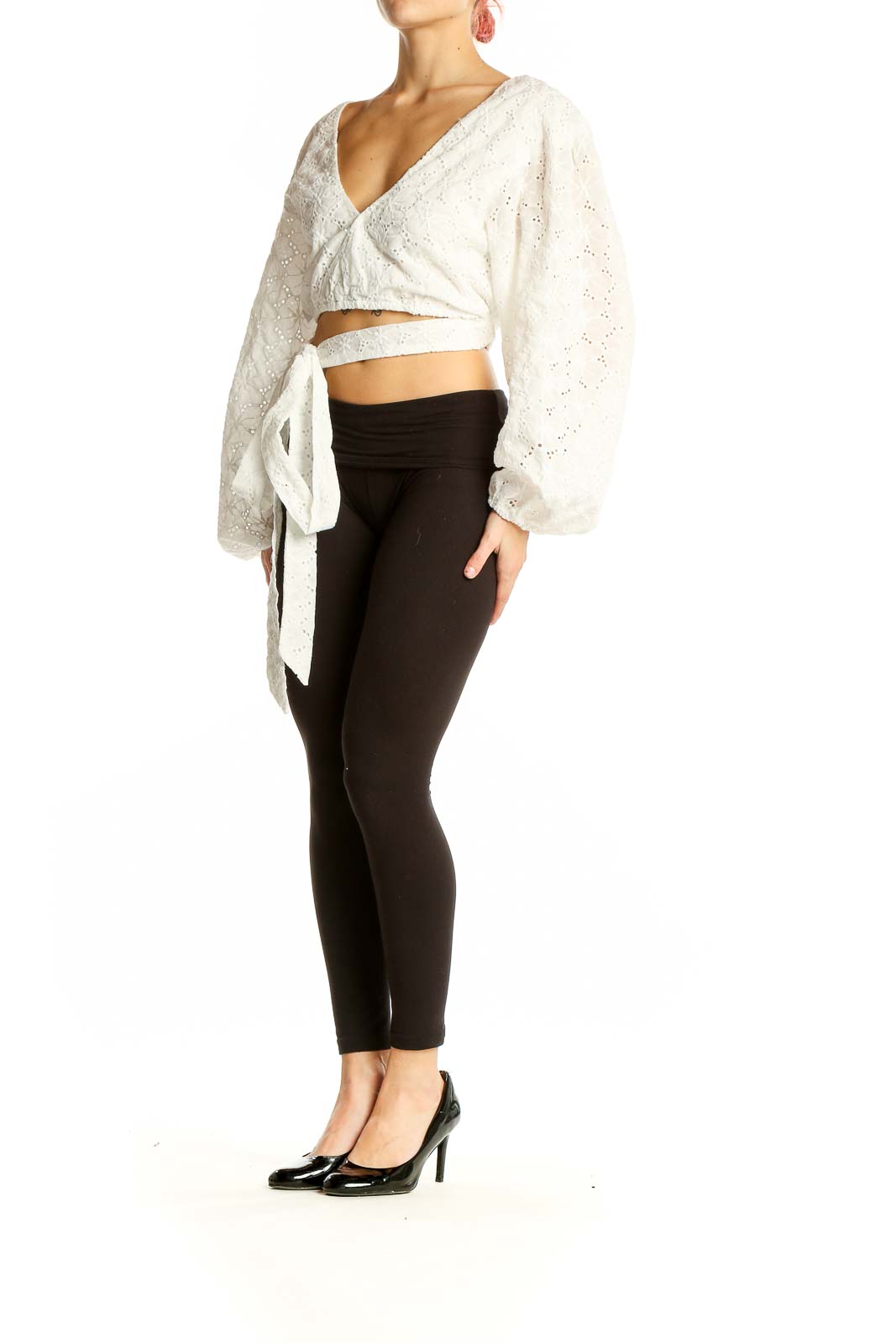 Front view of white eyelet lace wrap crop top with balloon sleeves