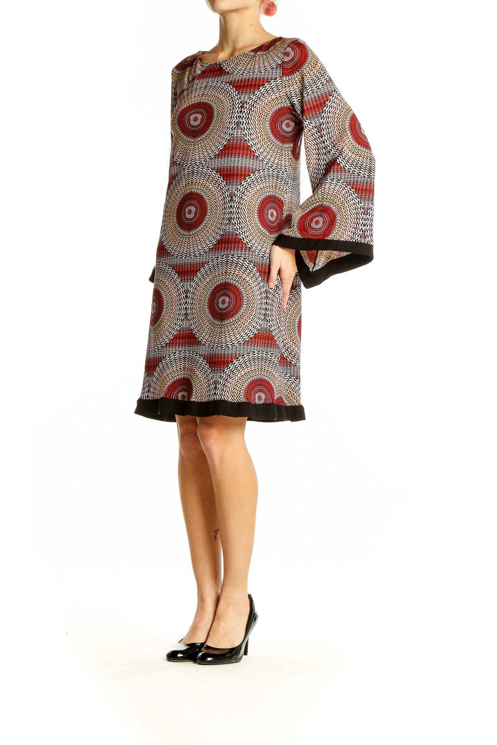 Front view of Emma & Michele red circular pattern shift dress