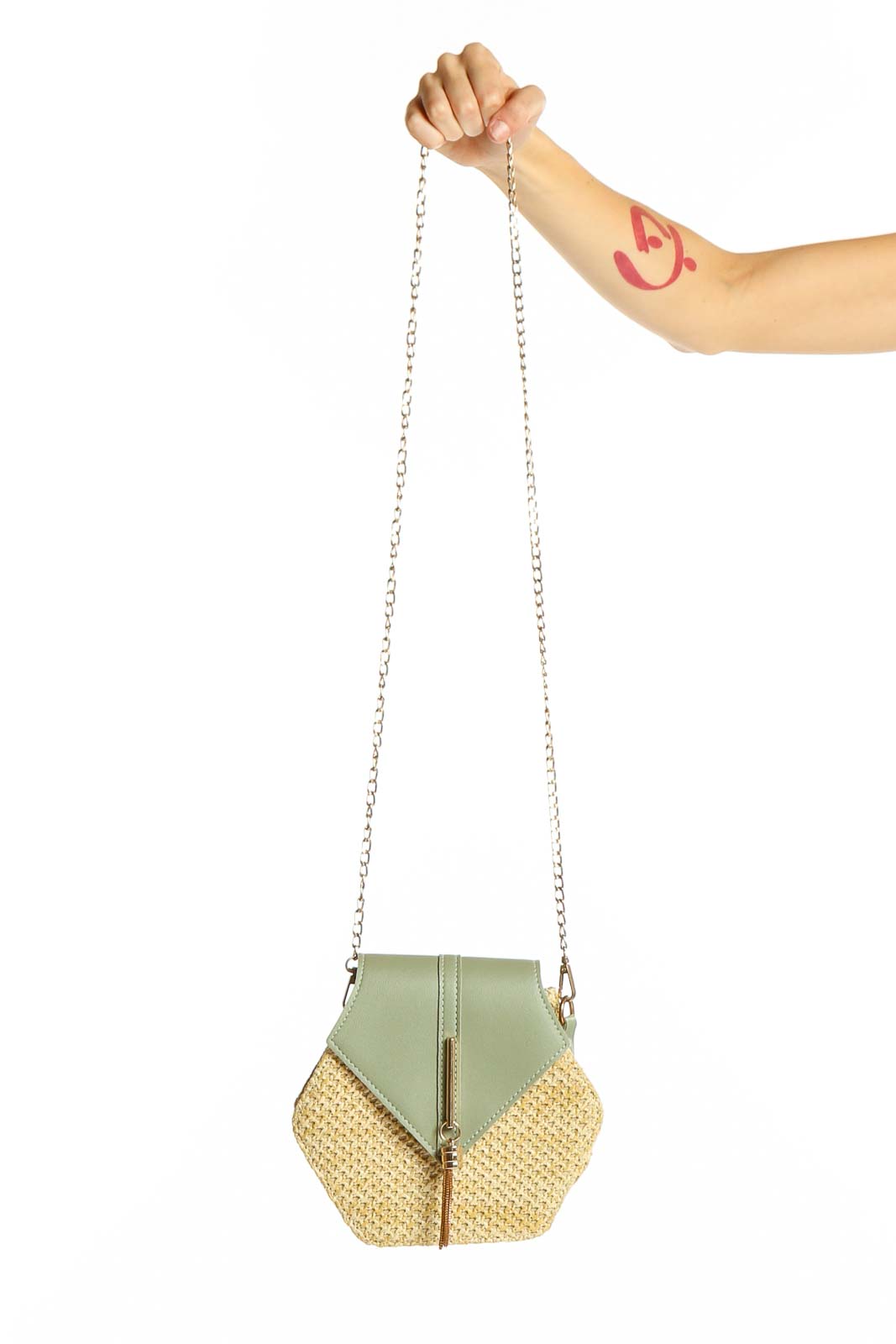 Front view of SilkRoll sage green and straw hexagonal clutch with chain strap