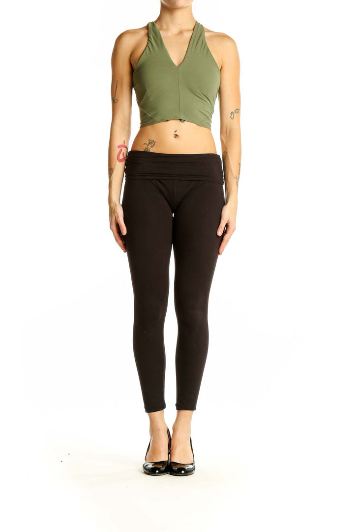 Front view of olive green Lululemon cropped workout top with V-neck