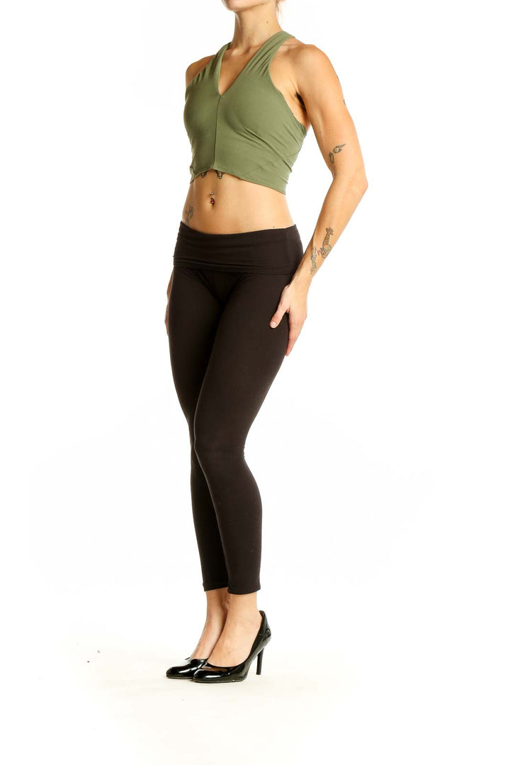 Front view of olive green Lululemon cropped workout top with V-neck