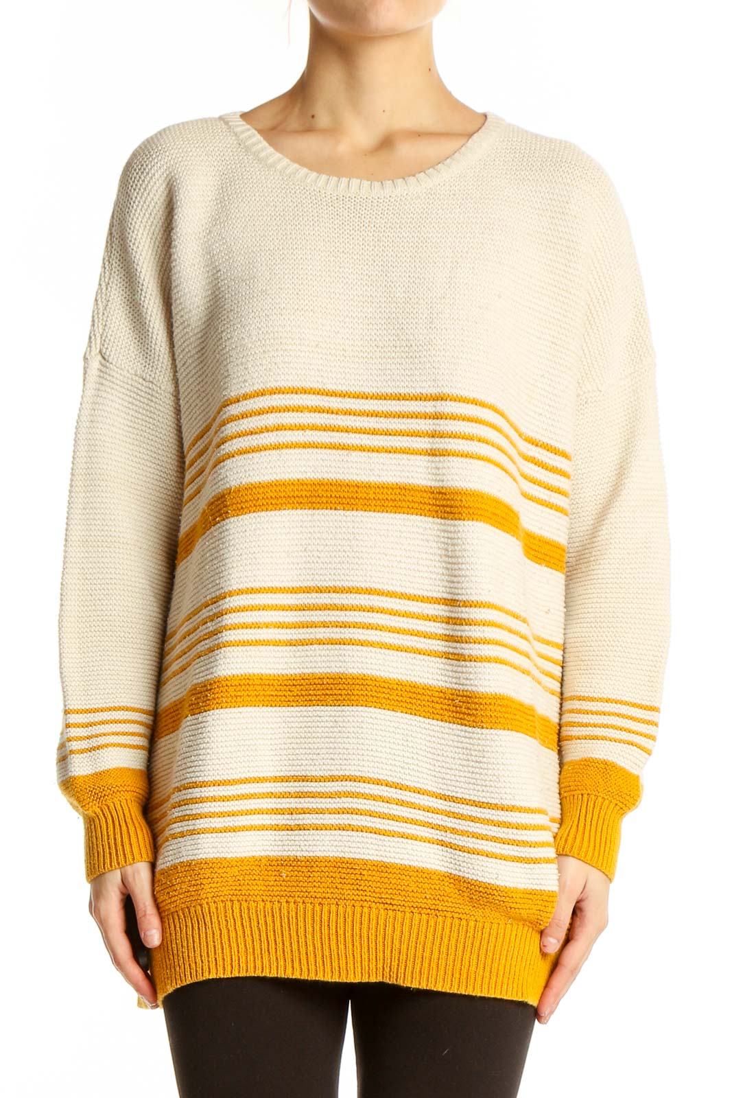 Front view of BDG cream and yellow striped oversized sweater