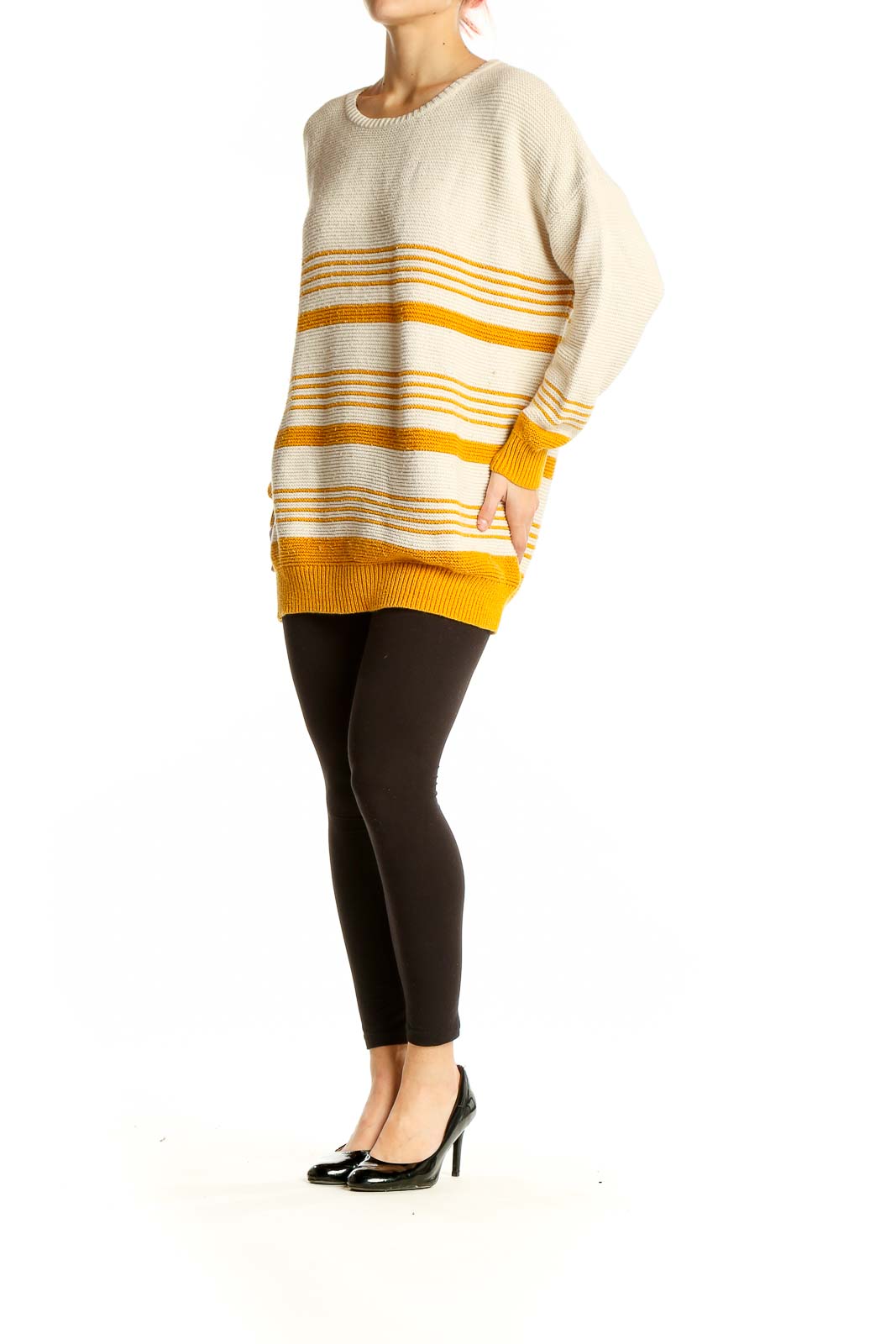 Front view of BDG cream and yellow striped oversized sweater