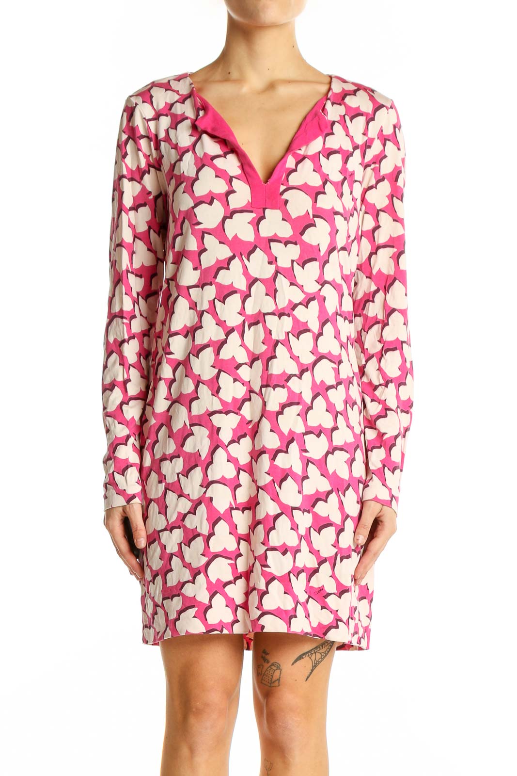 Front view of pink Diane von Furstenberg dress with white heart print and V-neckline