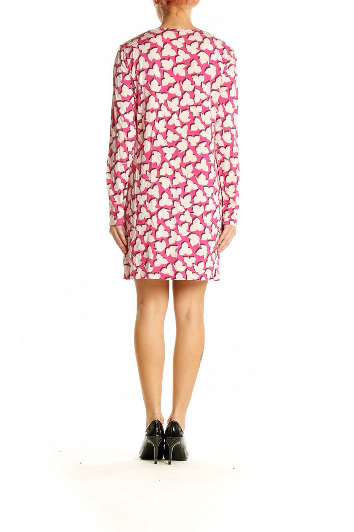 Side view of pink Diane von Furstenberg dress showing long sleeves and heart print pattern