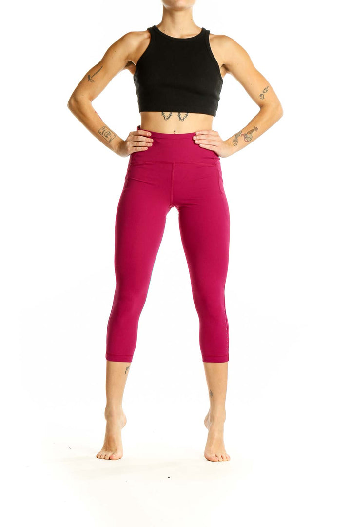 Front view of burgundy Lululemon high-waisted capri leggings