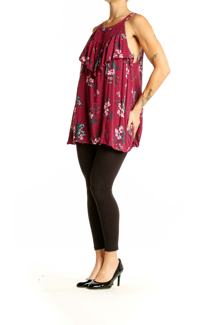 Front view of Torrid burgundy floral tank top with ruffle detail