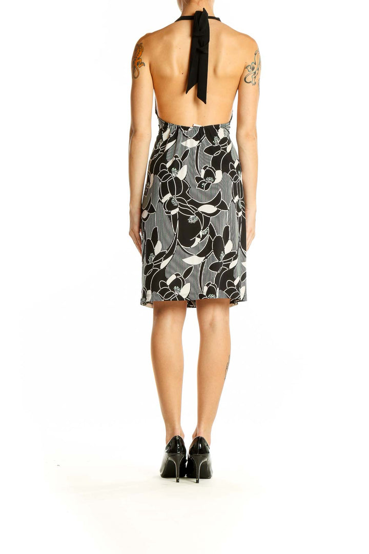 Back view of SilkRoll Black and White Floral Halter Dress showing halter neck design