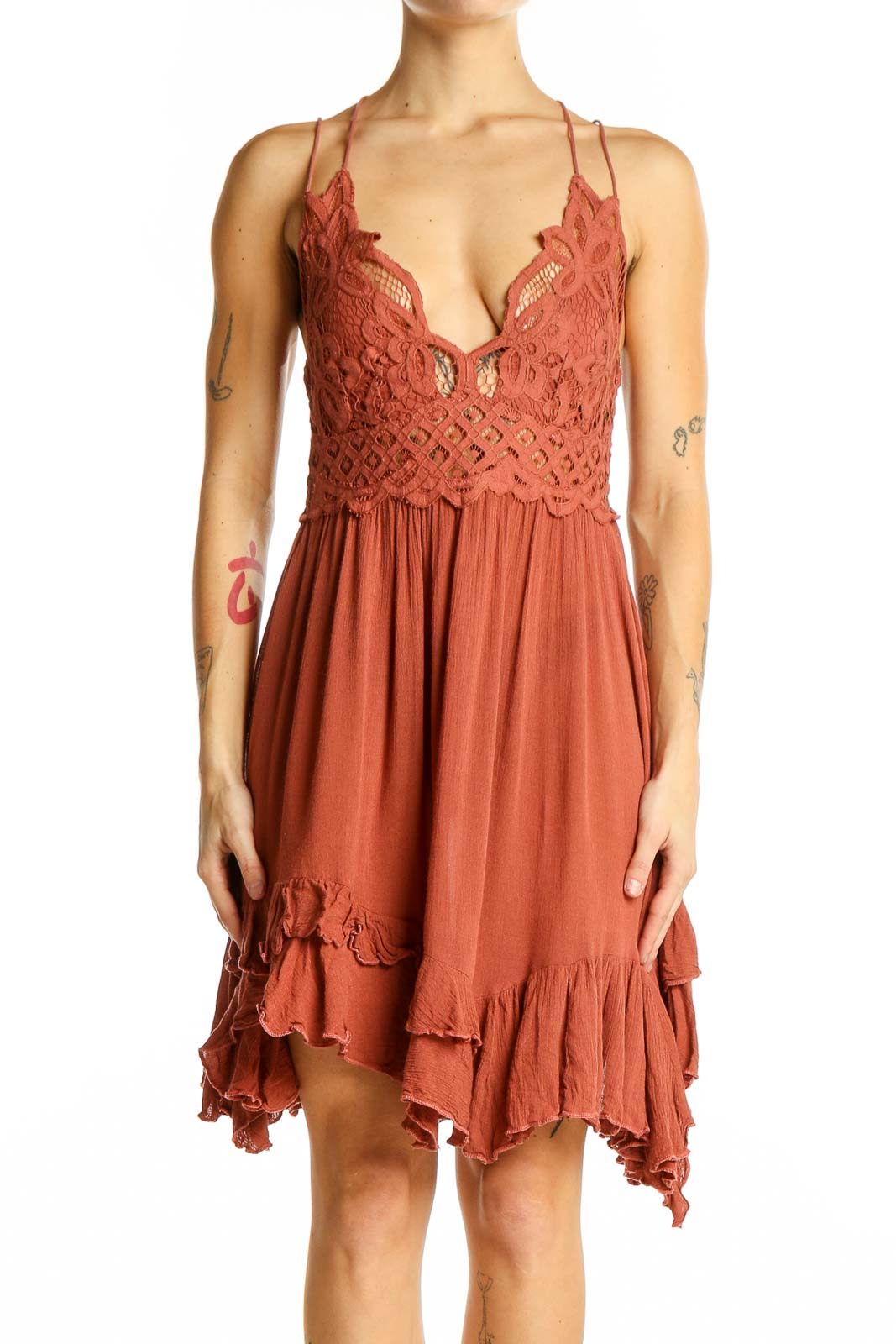 Front view of Free People terracotta mini dress with lace bodice and flowy skirt