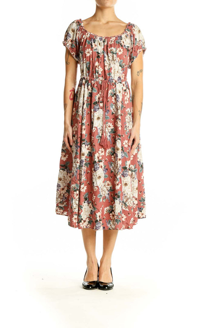 Front view of coral floral midi dress with gathered neckline and flutter sleeves