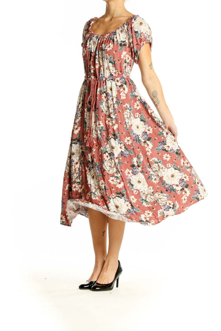 Front view of coral floral midi dress with gathered neckline and flutter sleeves