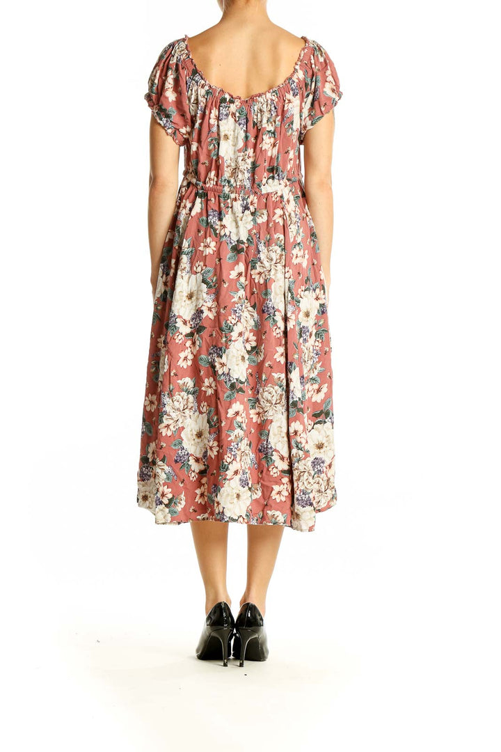 Back view of coral floral midi dress showing full skirt and drawstring waist