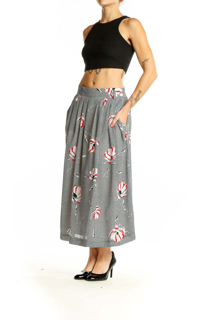 Front view of Jones New York black and white gingham midi skirt with red floral prints