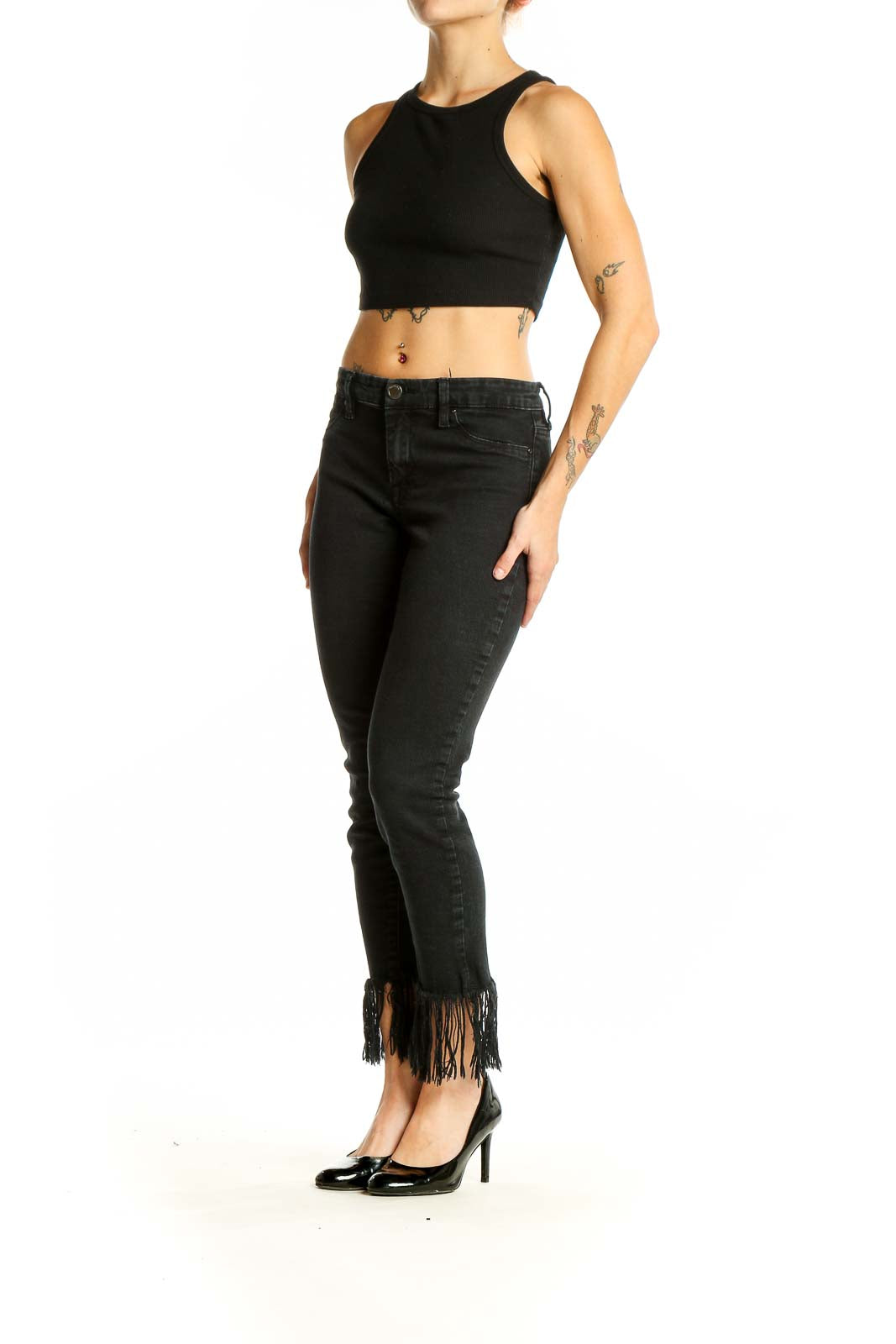 Front view of BLANKNYC black skinny jeans with fringe hem