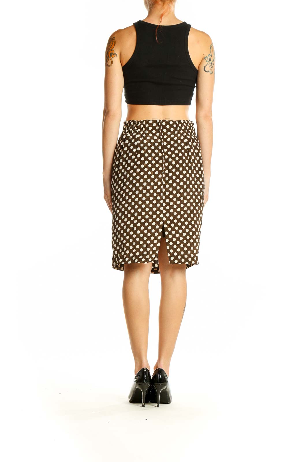 Side view of Chi Ya Ca brown polka dot pencil skirt with black crop top