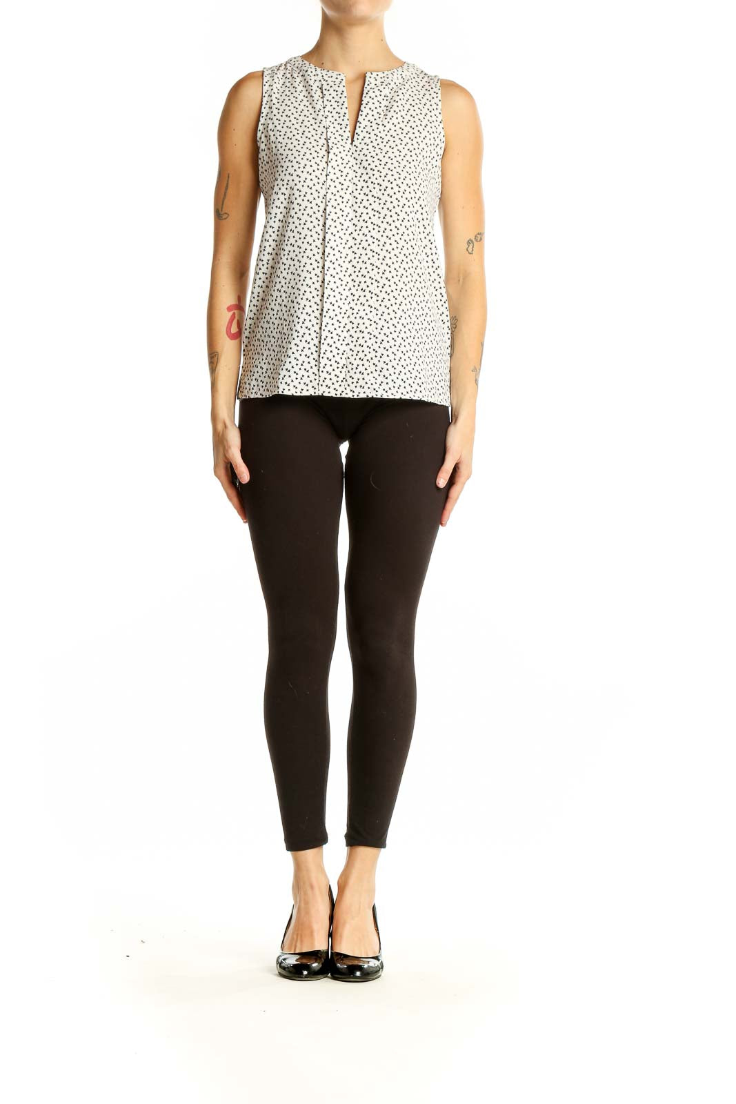 Front view of Ann Taylor white sleeveless blouse with black polka dots