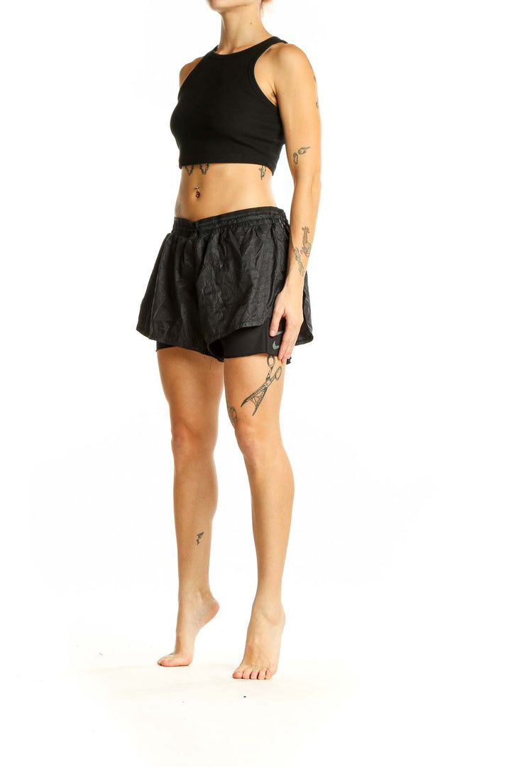 Front view of black Nike layered running shorts with crinkle-textured outer shell