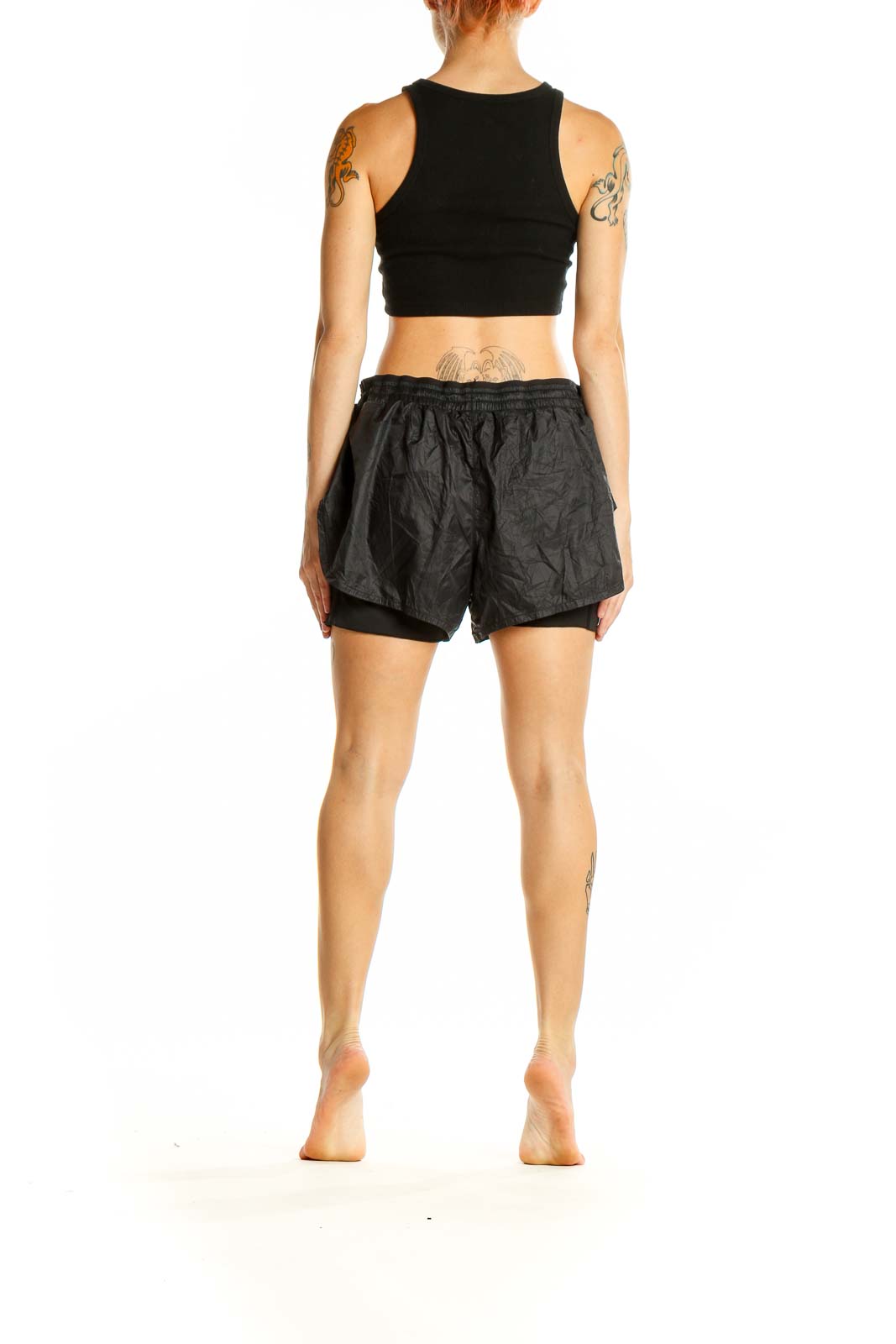 Side view of black Nike layered running shorts showing double-layer design