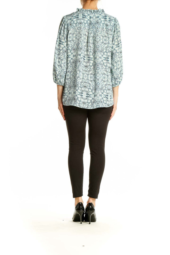 Back view of Veronicam blue floral print peasant blouse showing billowy sleeves and relaxed fit